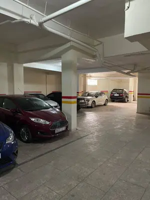 a parking garage with several cars parked in it at Private, Air Conditionner and Free Parking in Fès