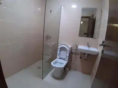 a bathroom with a toilet and a sink and a shower at Private, Air Conditionner and Free Parking in Fès