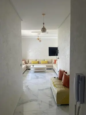 a living room with a couch and a tv at Private, Air Conditionner and Free Parking in Fès