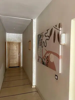 a hallway with a painting on the wall at Private, Air Conditionner and Free Parking in Fès