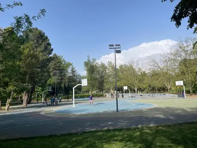a group of people playing basketball on a basketball court at Chalet villa QUE POUR LES FAMILLES in Imouzzer Kandar