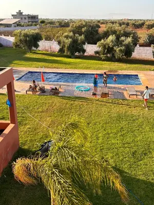 a group of people playing in a swimming pool at AYOR FES in El Oulaij