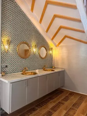 a bathroom with two sinks and two mirrors at AYOR FES in El Oulaij