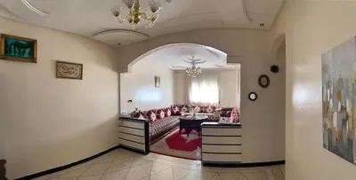 a living room with a couch and a table at Appartement meublé à louer in Meknès