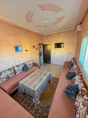 a living room with a couch and a table at Soofhouse in Fès