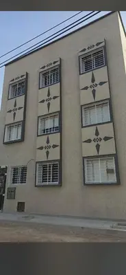 a building with stars painted on the side of it at Soofhouse in Fès