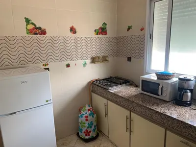 a kitchen with a microwave and a stove and a counter at Soofhouse in Fès