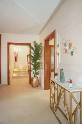 a hallway with a table and a potted plant at Villa Treasure of Marrakech in Marrakech