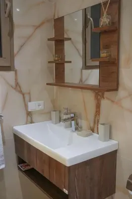 a bathroom with a white sink and a mirror at Villa Treasure of Marrakech in Marrakech