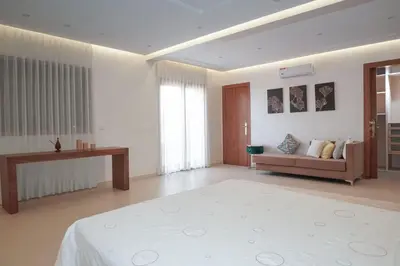 a large living room with a bed and a couch at Villa Treasure of Marrakech in Marrakech