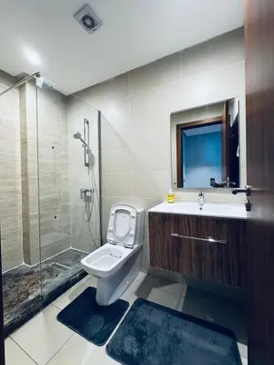 a bathroom with a toilet and a shower and a sink at Lo Belle Vie à Perstigia in Fès