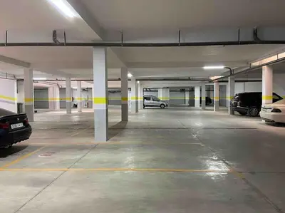an empty parking garage with cars parked in it at Lo Belle Vie à Perstigia in Fès