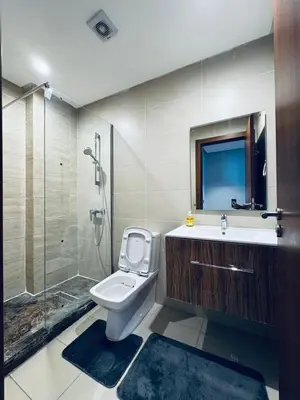 a bathroom with a toilet and a shower and a sink at Lo Belle Vie à Perstigia in Fès