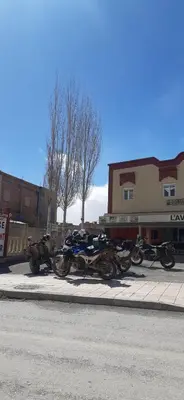 a group of motorcycles parked on the side of the street at Auberge l' avenir in Imilchil