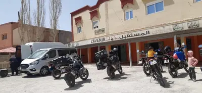 a group of motorcycles parked in front of a building at Auberge l' avenir in Imilchil