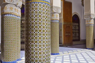 a building with a column with yellow and white polka dots at Riad Palais Bahia Fes in Fès