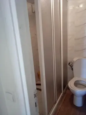 a bathroom with a white toilet in a room at maison Halima in Ifrane