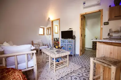 a living room with a couch and a table at Villa Roswell Marrakech in Marrakech