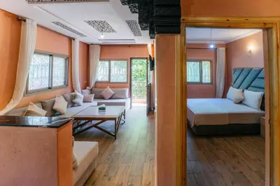 a room with a bed and a couch and a table at The best apartments of Ourika valley in Setti Fatma