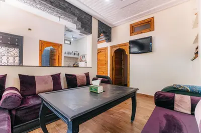 a living room with a couch and a table at The best apartments of Ourika valley in Setti Fatma