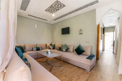 a living room with a couch and a table at The best apartments of Ourika valley in Setti Fatma