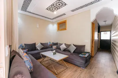 a living room with a couch and a table at The best apartments of Ourika valley in Setti Fatma