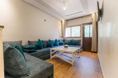 a living room with a couch and a table at The best apartments of Ourika valley in Setti Fatma