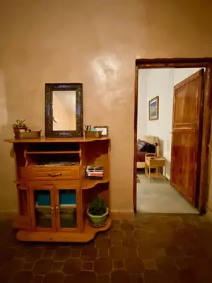 a mirror on top of a dresser in a room at Les chandelles in Tinerhir