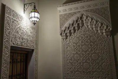 an ornate door to a room with a chandelier at Riad Taryana in Fès
