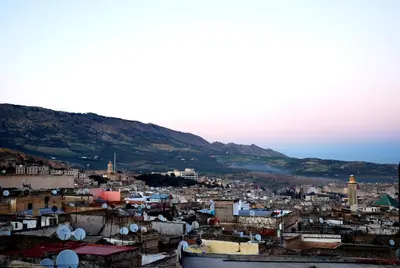 a view of a city with mountains in the background at Dar Hafsa in Fès