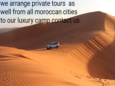 an image of a car in the desert at Merzouga Magic Carpet camp in Merzouga