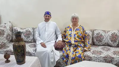 a man and a woman sitting on a couch at Dar zerhane in Fès