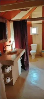 a bathroom with a sink and a toilet at Merzouga Majestic Camp in Merzouga