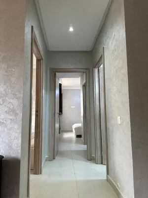 a hallway of a room with doors and a bedroom at Ifrane apartment with swimming pool in Ifrane
