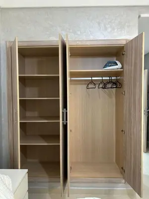 a closet with a door open with a computer on it at Ifrane apartment with swimming pool in Ifrane