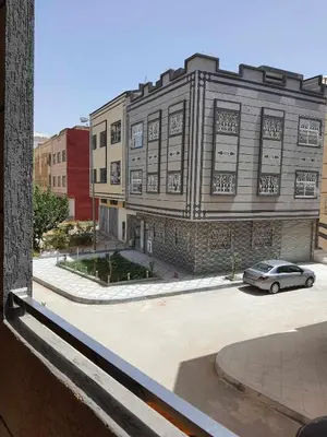 a building with a car parked in front of it at Appartement Dar Meknès in Meknès