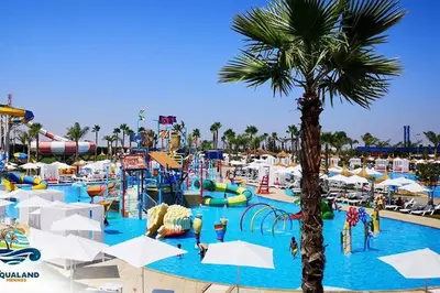 a pool at a water park with a theme park at Appartement Dar Meknès in Meknès
