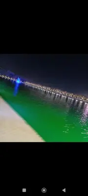 a view of the ocean at night with lights at Chez-soi in Meknès