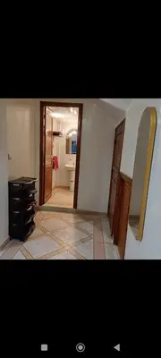 a room with a bathroom with a sink and a mirror at Chez-soi in Meknès