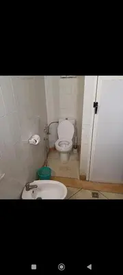 a small bathroom with a toilet and a sink at Chez-soi in Meknès
