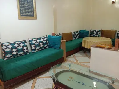a living room with a couch and a table at Chez-soi in Meknès