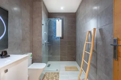 a bathroom with a shower and a toilet and a sink at villa Safa, confort et relax, piscine Chauffée, hammam in Marrakech