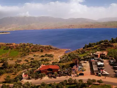 a view of a lake with mountains in the background at Hotel Bin El Ouidane in Bine el Ouidane