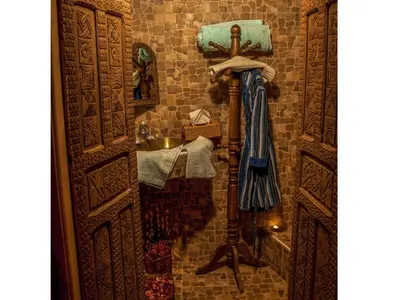 a small bathroom with a sink and a mirror at Hotel Bin El Ouidane in Bine el Ouidane