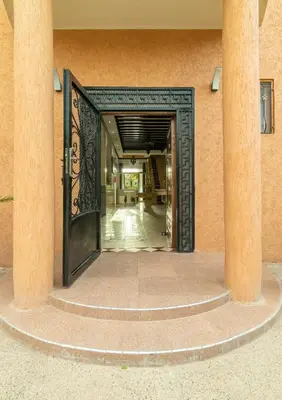 an open door into a building with columns at Oasis Oumifis in Marrakech