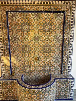 a room with a wall with a patterned wall at Oasis Oumifis in Marrakech