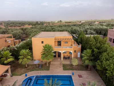 an aerial view of a house with a swimming pool at Oasis Oumifis in Marrakech