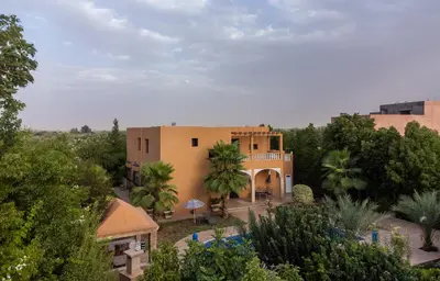 an aerial view of a building with trees at Oasis Oumifis in Marrakech