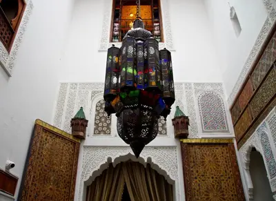 a chandelier hanging from the ceiling of a building at Riad Sanaa Rose in Fès