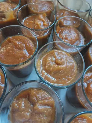 a bunch of glass cups filled with peanut butter and donuts at Riad ma bonne étoile in Kasr Bounou